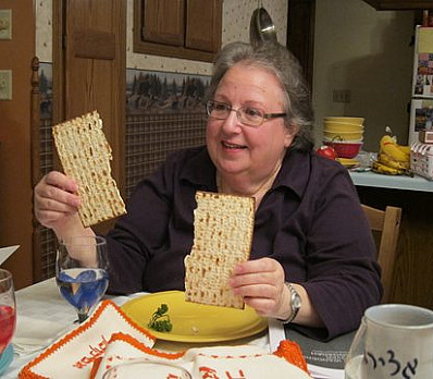 Breaking the Middle Matzah in Two
